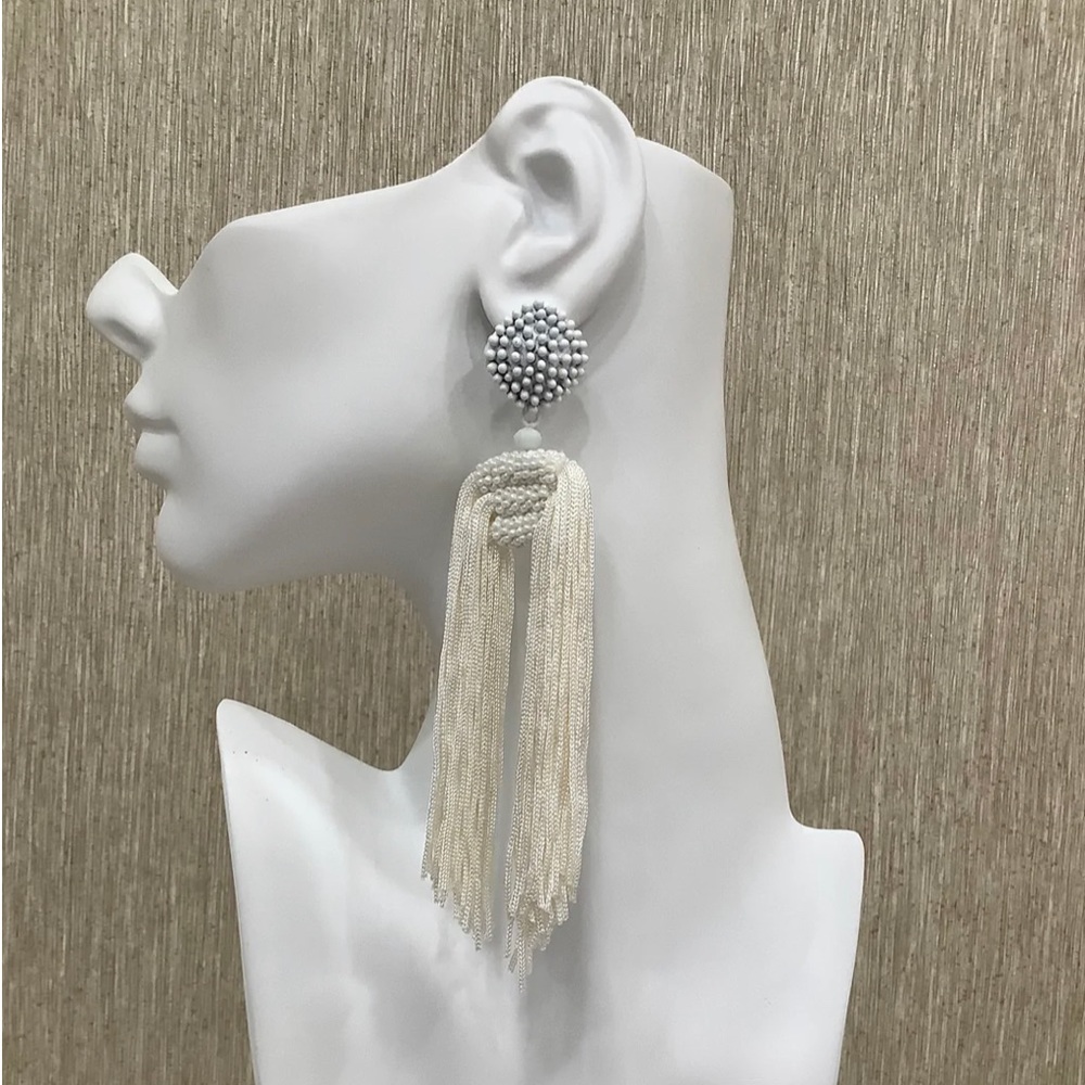 TQTA “The Statement” Tassel Earrings In White.